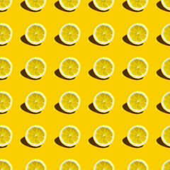 Food pattern with lemons on yellow paper background. Top view. Summer concept.