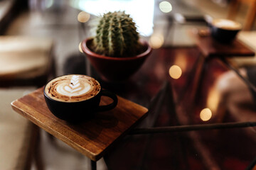 cup of coffee on table in cafe, vintage style copy space