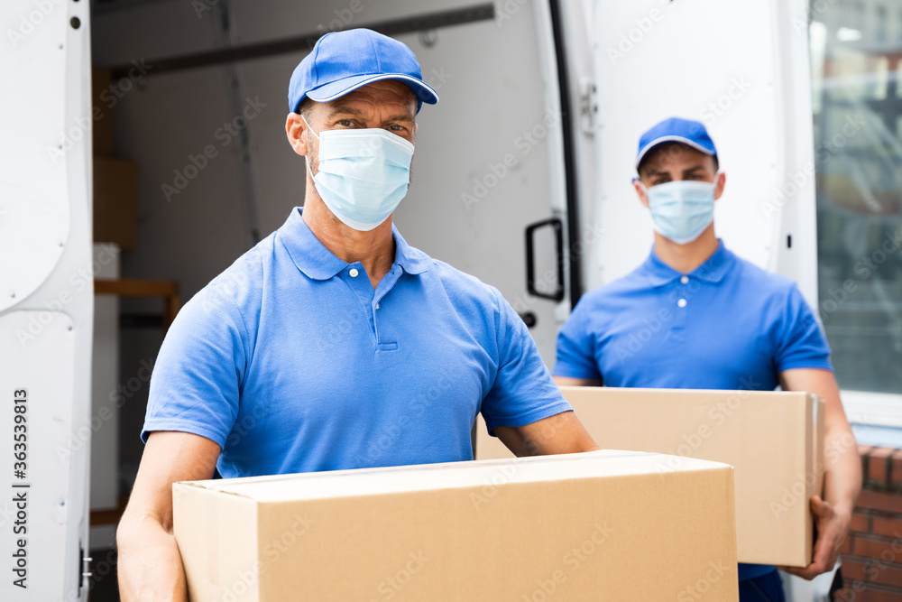 Wall mural blue delivery men unloading package from truck