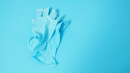 Latex gloves or Surgical gloves on blue background.