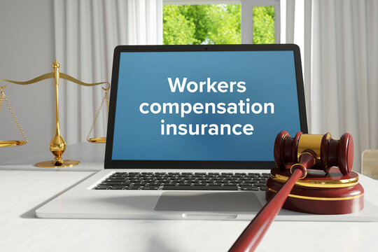 Workers Compensation Insurance. Law. A Lawyer Laptop On A Desk In The Office. Text On The Screen. Libra, Juctice, Web