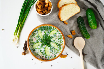 Traditional Russian summer cold soup, okroshka. Bulgarian cold soup, Tarator served on the table.