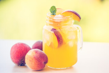 Summer ice cold drink. Peach cocktail 