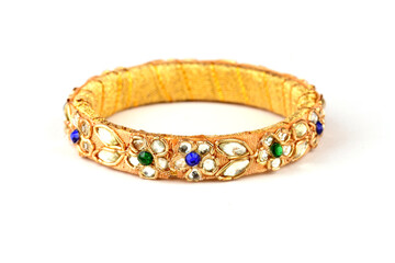 Indian golden Bangles. Bracelet with diamonds and stones on a white background, Indian Traditional Jewellery,Style, fashion and design of jewelry