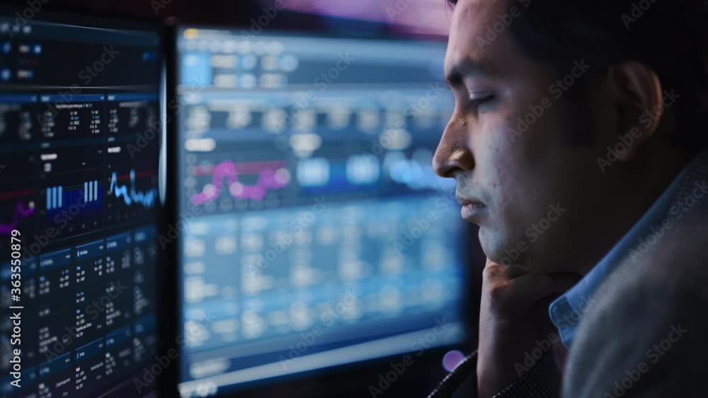 Poster confident handsome man looks at computer monitor, screen showing data, infographics, information, st