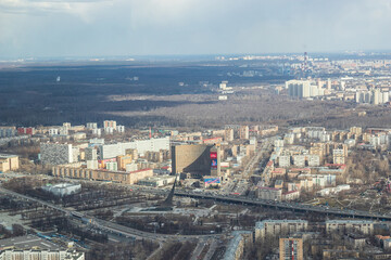 Russia, Moscow, 2019: view from the Ostankino TV tower to the city panorama, residential multi-storey buildings, the Cosmos hotel and the monument to space explorers
