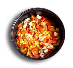 mouth-watering tasty vegetables red bell pepper carrots cucumber dill greens tomato onion shredded fried chicken meat in a pan together on a white background top view