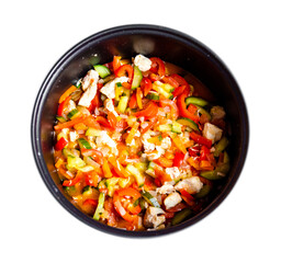 mouth-watering tasty vegetables red bell pepper carrots cucumber dill greens tomato onion shredded fried chicken meat in a pan together on a white background top view