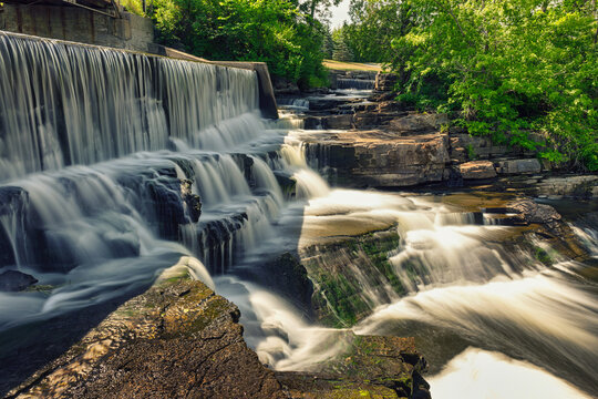 Buttermilk Falls and Mill in Forest Mills Ontario with long exposure waterfalls and original Mill in the forest.