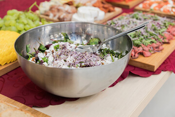 Salad bowl, salad with sprouted seeds and beets. View from above. Selective focus. In the background snacks on a wooden tray.