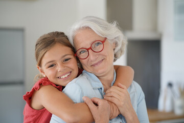 Portrait of smiling grandmother with grandkid - 363556630