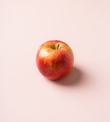 Seasonal apple fruit at pink solid background