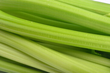 fresh Celery stalk isolated on white wooden background
