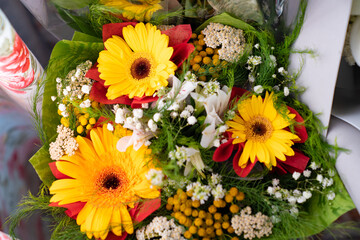 top view of bouquets of fresh yellow flowers. gift for holiday or anniversary.
