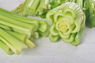 fresh Celery stalk isolated on white wooden background