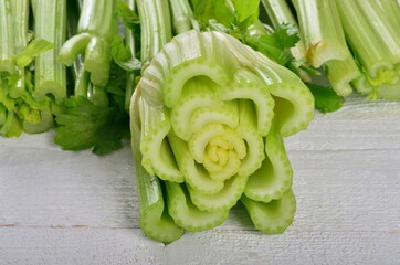 fresh Celery stalk isolated on white wooden background