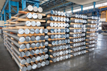 Fototapeta Billets of aluminium in the factory. Manufacturing process by which a liquid material is usually poured into a mold, which contains a hollow cavity of the desired shape, and then allowed to solidify. obraz