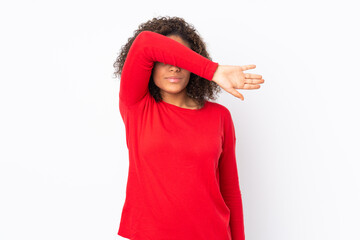 Young African American woman isolated on background covering eyes by hands