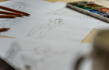 How to draw. The artist worskspace with pencils on the white paper, art, craft, creativity,...