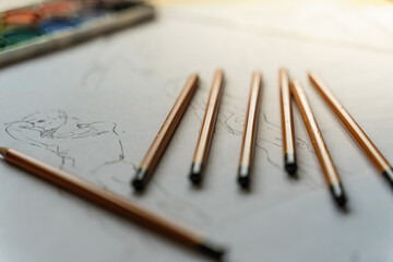 How to draw. The artist worskspace with pencils on the white paper, art, craft, creativity,...