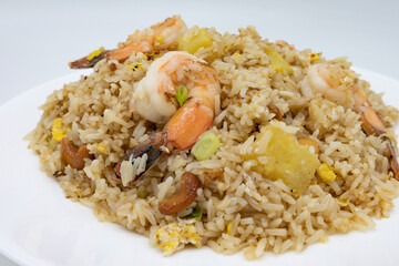 Closeup of Thai Fried Rice with Shrimp and Pineapple on a White Plate