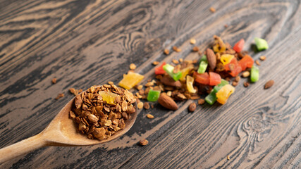 Spoon baked oatmeal with nuts and dried fruits. Advertising backdrop for granola. Homemade granola recipe