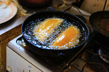 Typical Venezuelan food, Cachapa or Arepa. Fry in the pan with oil.