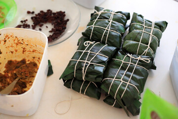 Hallacas tied with banana leaf, typical Venezuelan food.