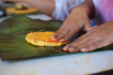Hands Kneading Hallacas, typical Venezuelan food.