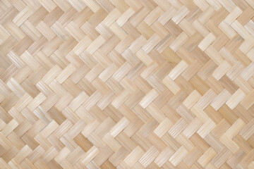 Texture details of bamboo weave. Vertical zigzag pattern of Thai wickerwork for furniture made from natural materials for background.