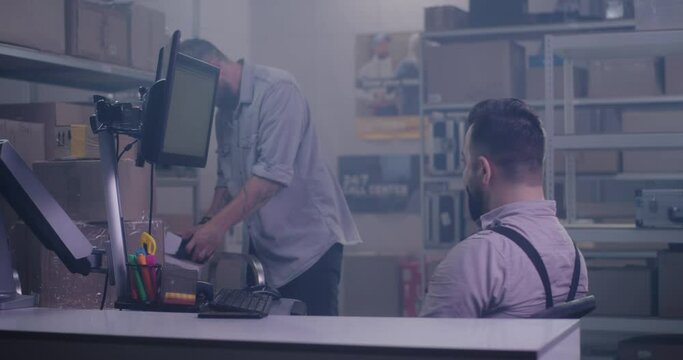 Worker photographing damaged package