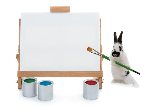  bunnies stand at the easel with tassels isolated on a white background.