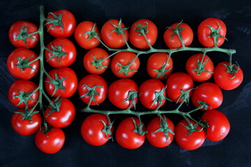 Vegetables on the table, frame of vegetables, radishes, cucumbers, tomatoes, garlic, black background.