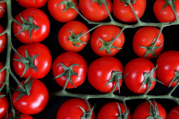 Vegetables on the table, frame of vegetables, radishes, cucumbers, tomatoes, garlic, black background.