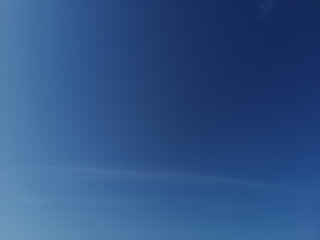 blue sky with scattered transparent  clouds