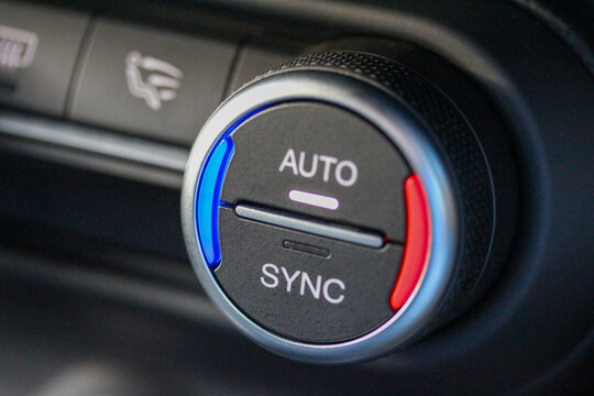 AUTO / SYNC ventilation knob in luxury vehicle