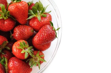 Bright home strawberries on white background with copy space. Summer fruits