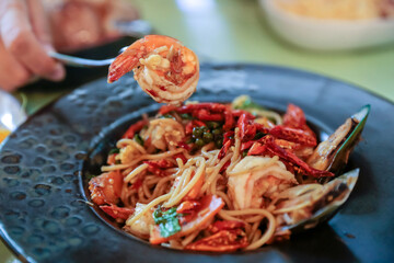 Spaghetti with Spicy prawn and Mixed Seafood, focus selective.