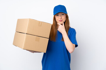 Young delivery woman over isolated white background laughing