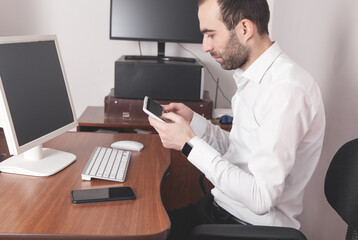 Fototapeta na wymiar Businessman using his digital tablet in office.