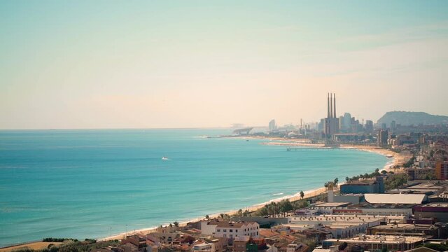 Static top view of the bay beach of an european city at daytime. Panoramic Barcelona area.