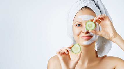 Cosmetology, skin care, face treatment, spa and natural beauty concept. Woman with facial mask...