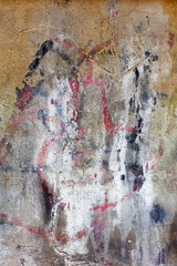 Hooligan smeared paint the walls of the old building. Landscape style. Grungy concrete surface with...