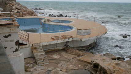 Abandoned swimming pool at sea