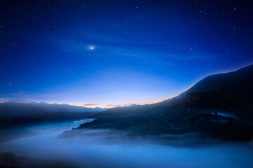 Fantastic night sky over mountains.