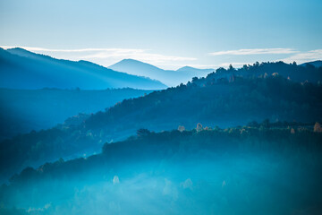 Fototapeta na wymiar Beautiful morning landscape with autumn foggy mountains.