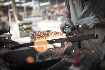 close up of a man working on a construction site, steel working