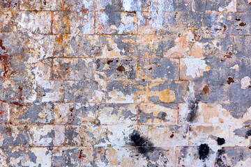Abstract background old white brick wall with cracks and scratches. Landscape style. Great background or texture.