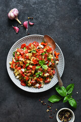 Spicy salad of baked eggplant, peppers and tomatoes. Eggplant caviar. Village ratatouille.