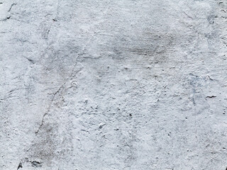 Creative background of rusty metal with cracks and scratches, casually painted white. Grungy metal surface. Great background or texture for your project.